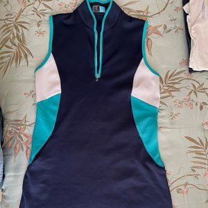 Ladies Sleeveless Golf Dress w/zip front neckline and piped edges.